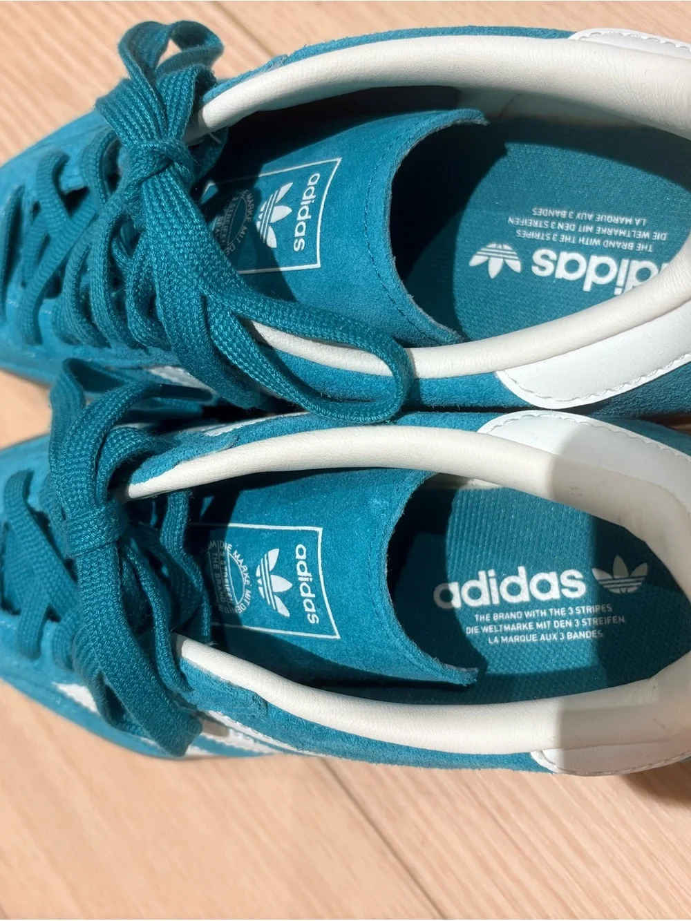 Adidas Teal Suede Athletic Shoes with White Stripe and gum bottom.